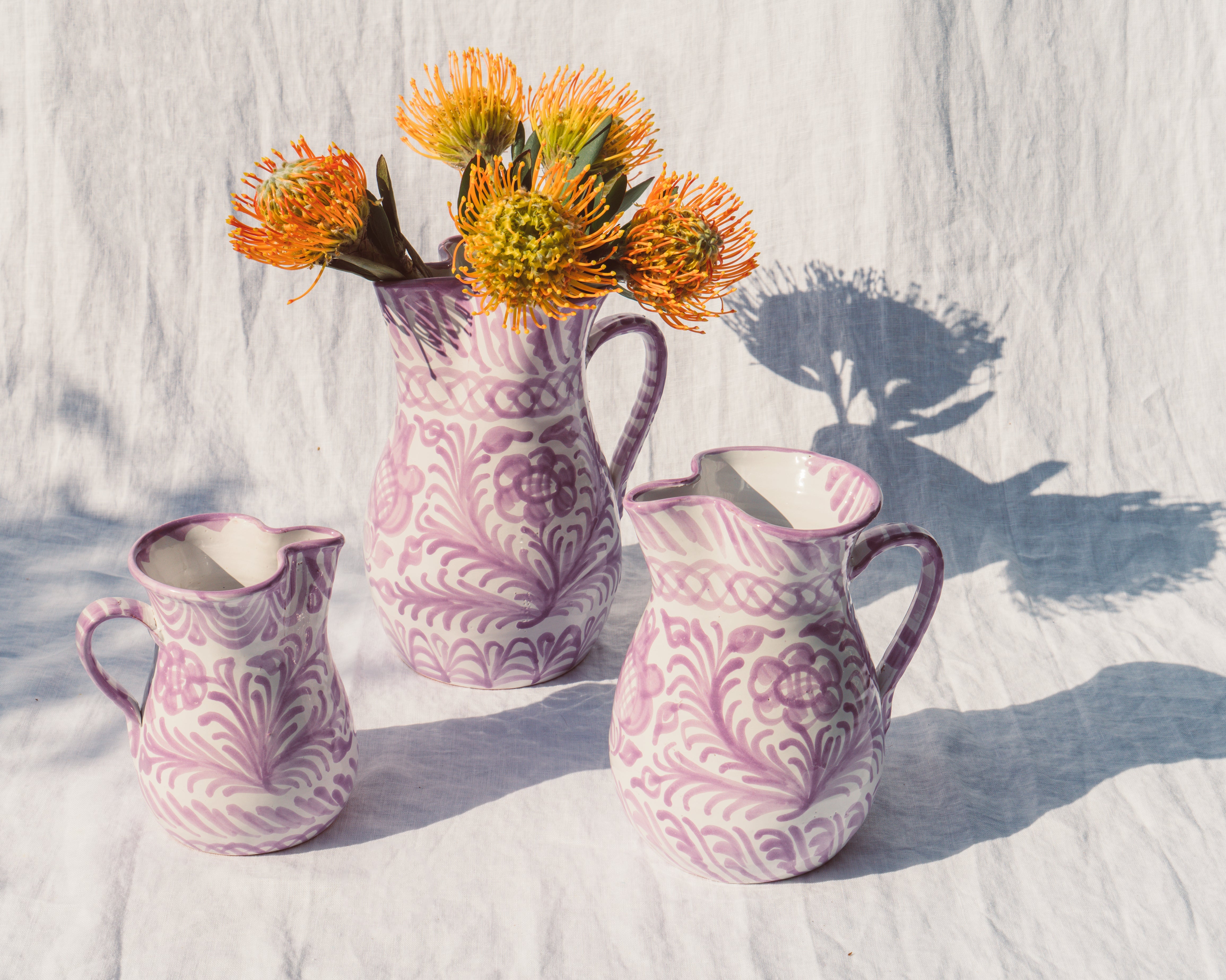 Large pitcher with hand painted designs