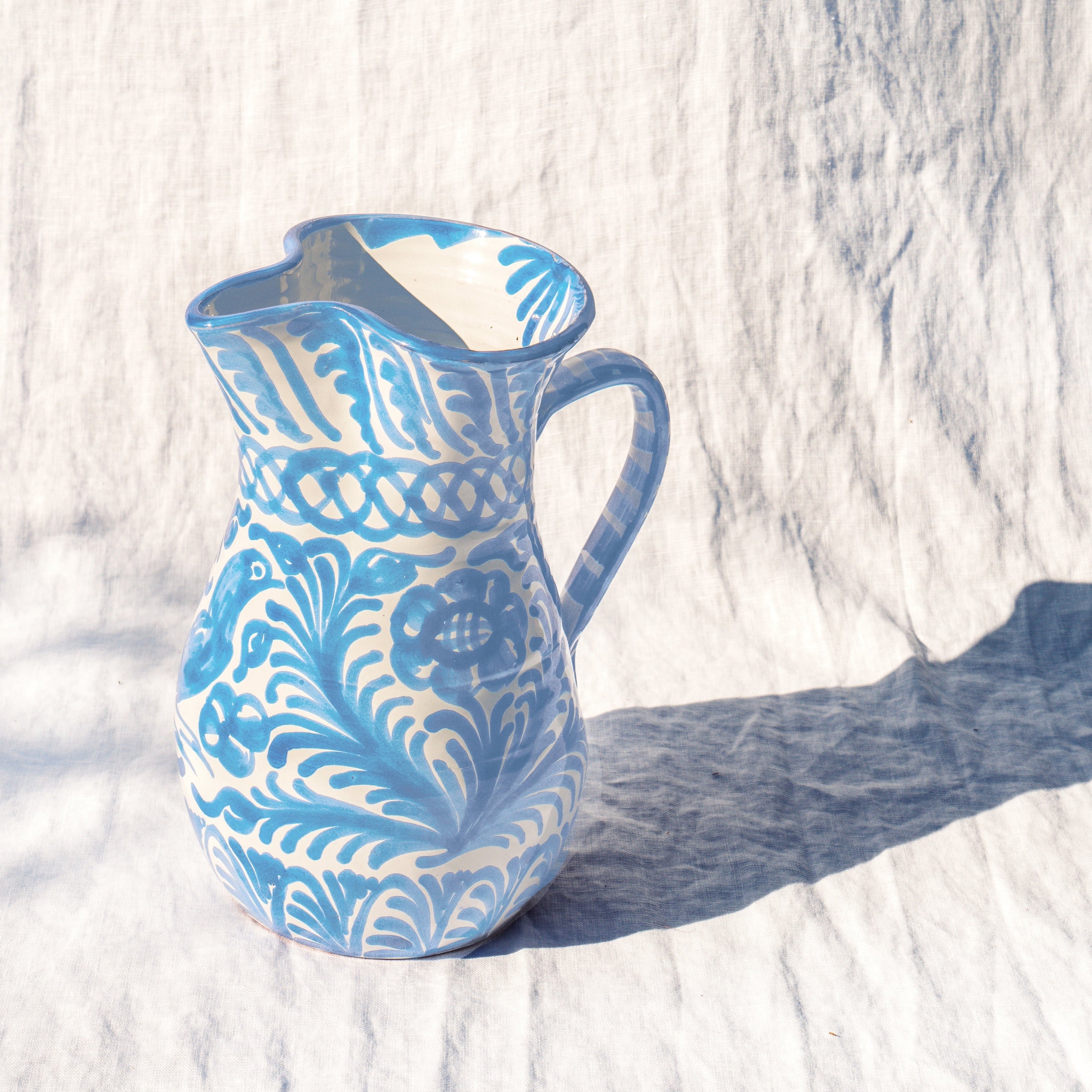 Large pitcher with hand painted designs