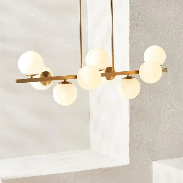 Imara Antique Gold Frame Chandelier in White Globe Shades - The Mayfair Hall