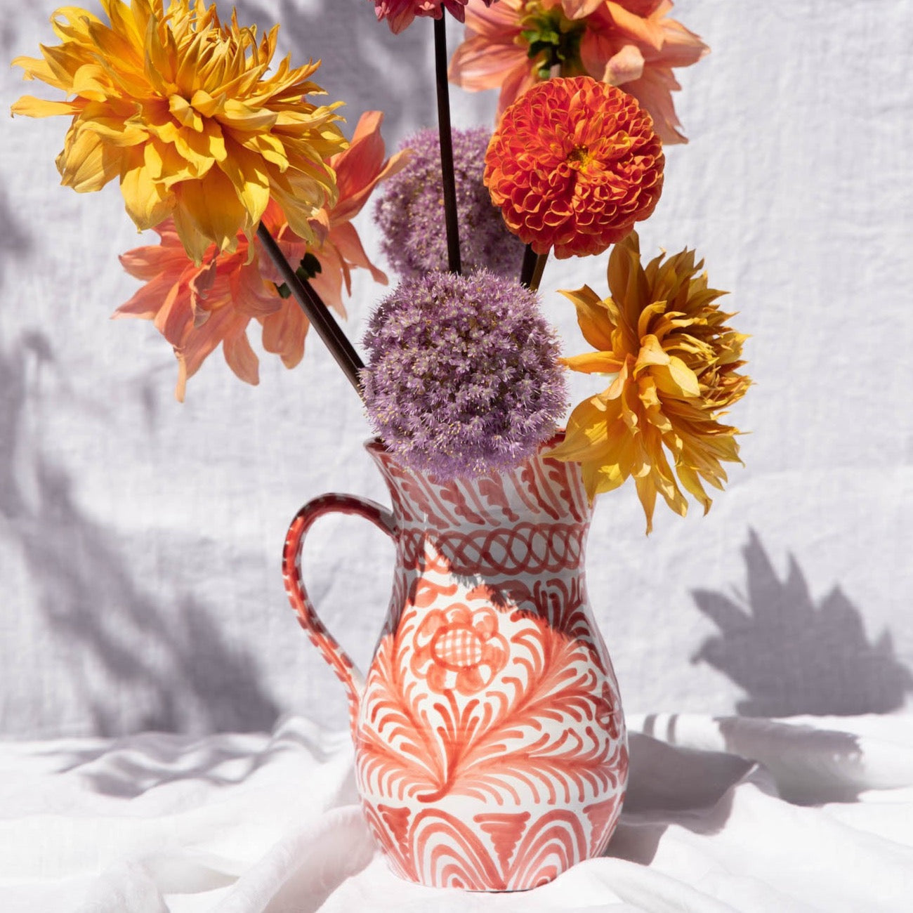 Large pitcher with hand painted designs