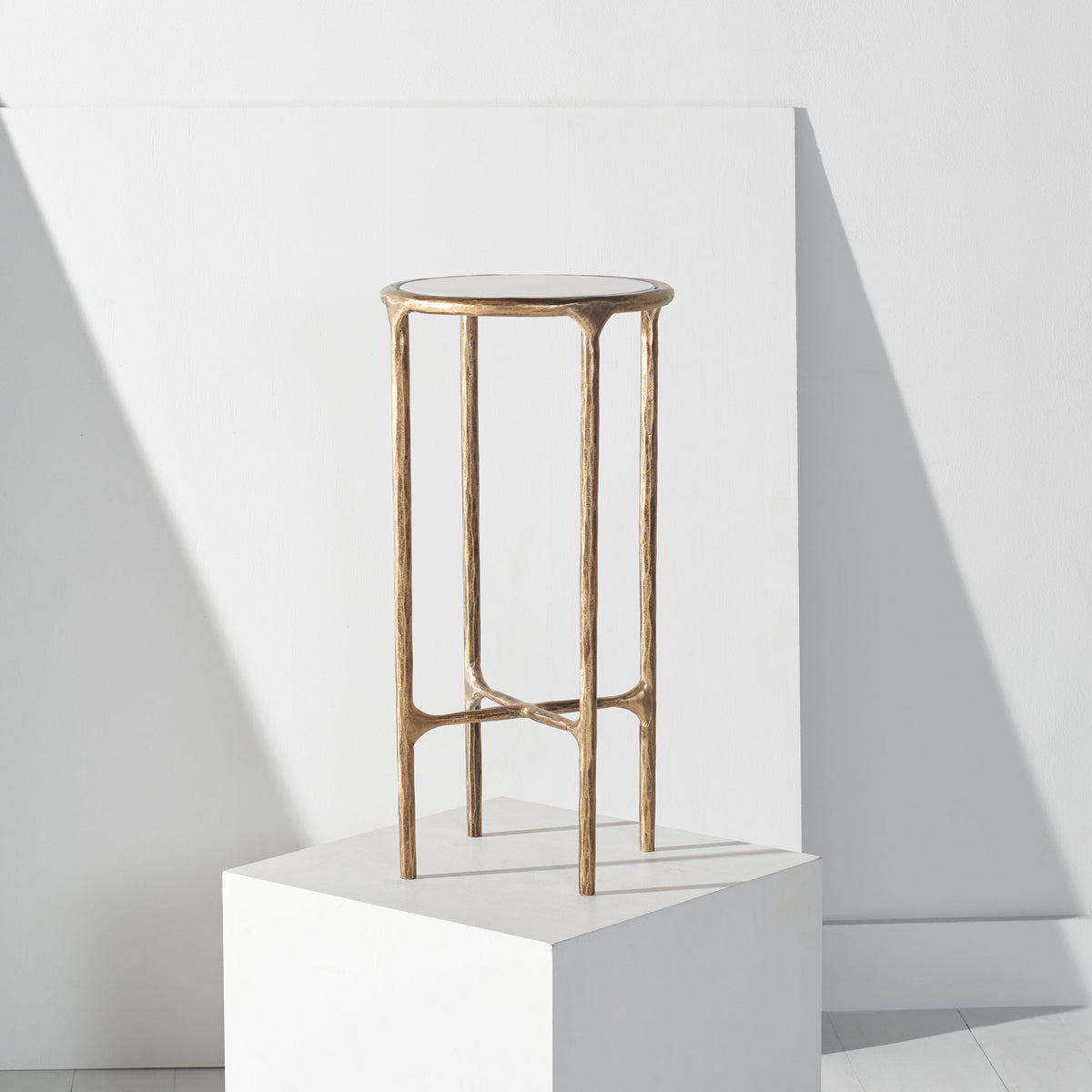 Jessa Forged Metal Tall Round End Table in Brass and White