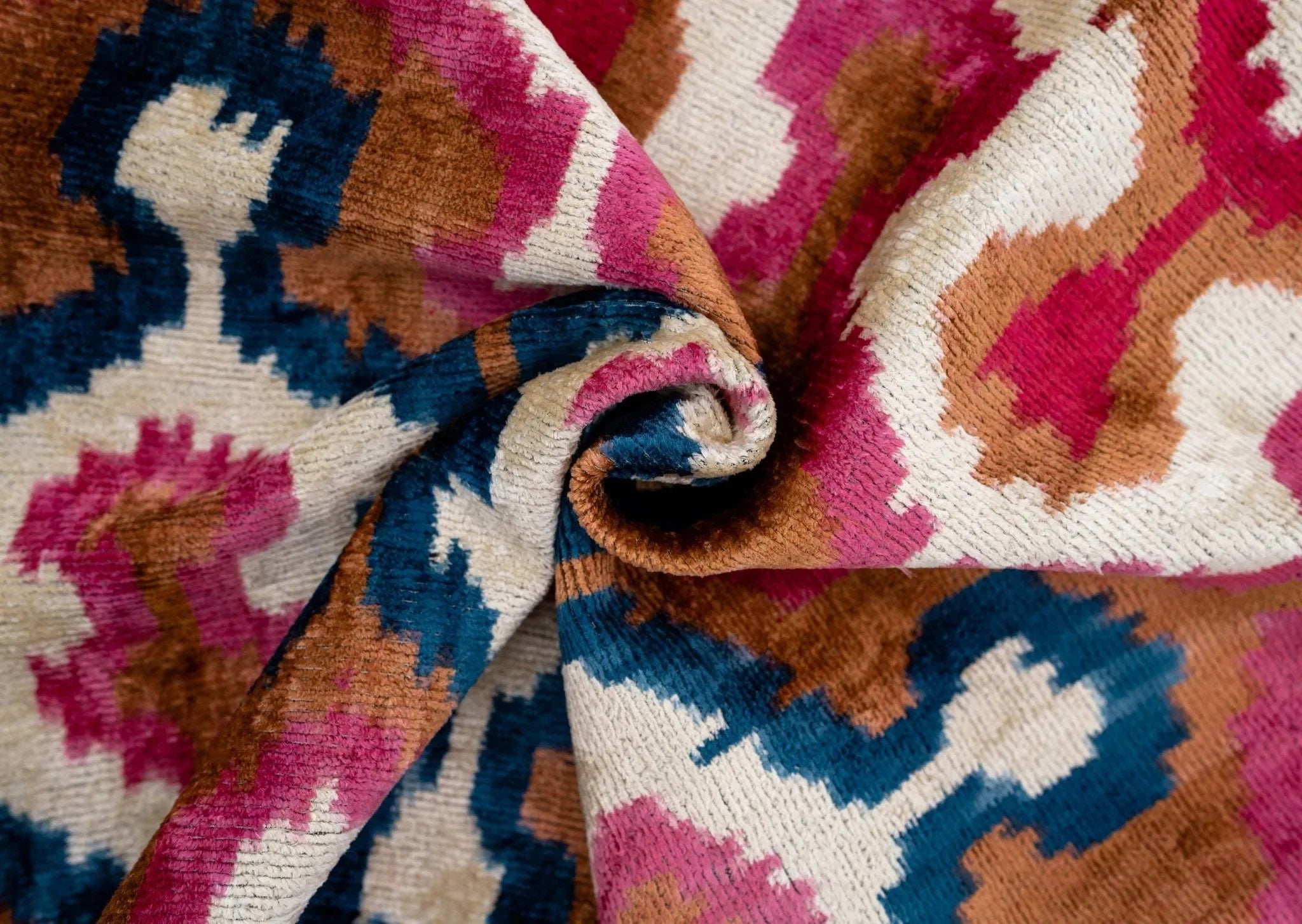 Handmade Velvet Throw Pillow with Pink, Blue, and Tan Ikat Design - High-Quality 20x20 Inch Decorative Accent with Premium Down Feather Insert - The Mayfair Hall