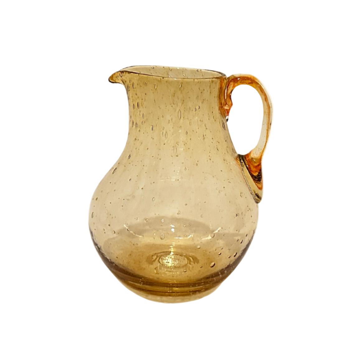 Glass pitcher with amber color on a white background