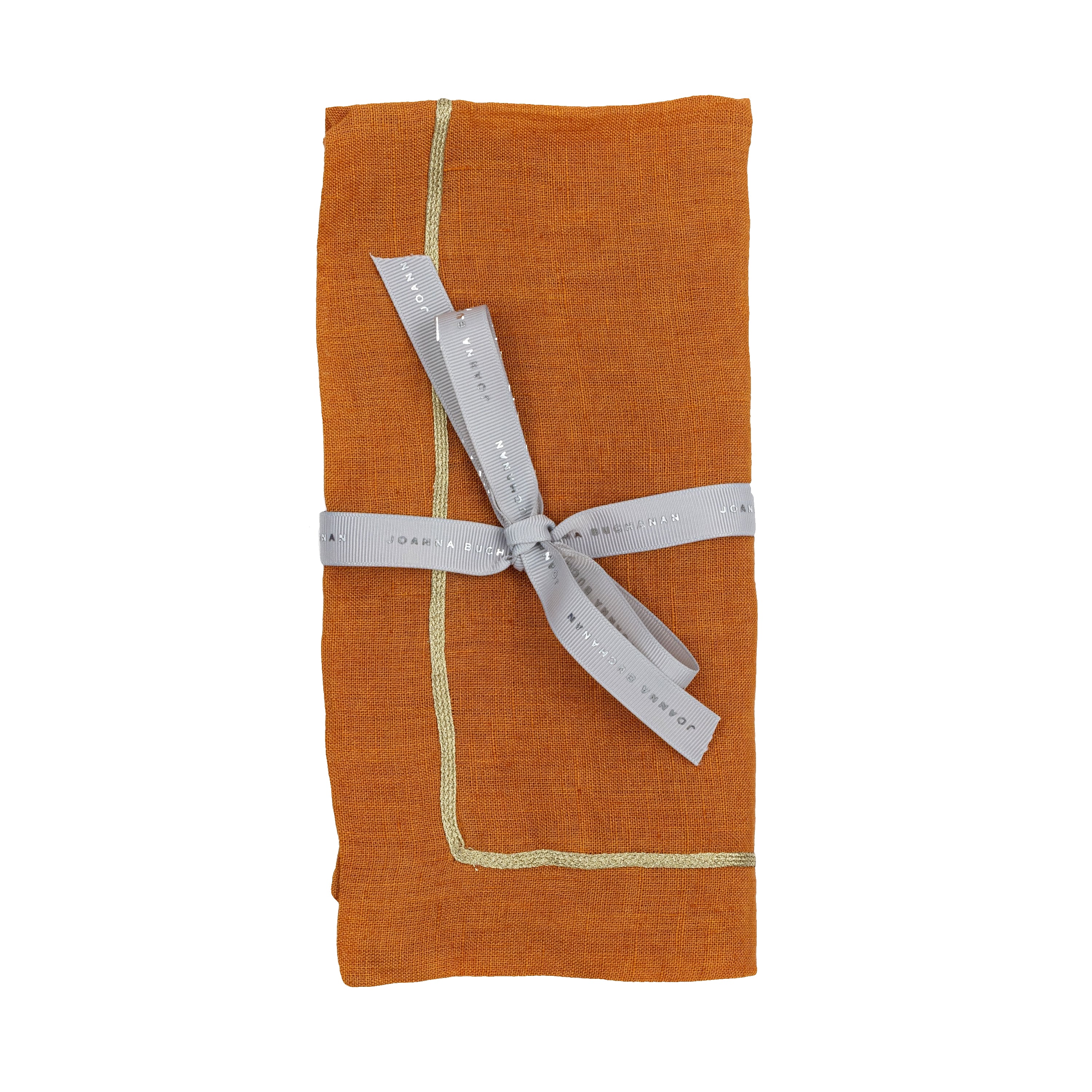 Orange napkin with gold trim and a silver ribbon on a white background
