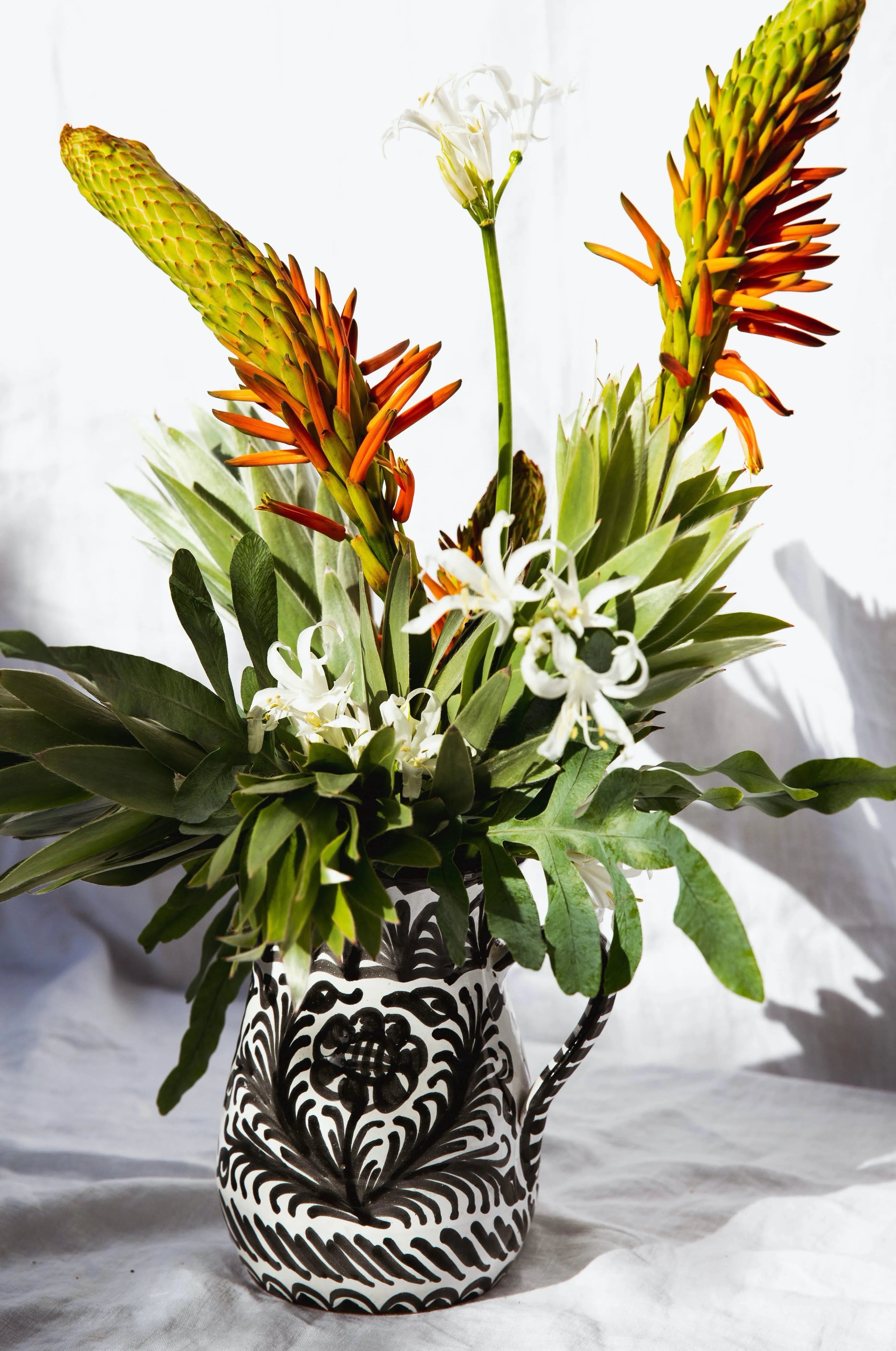 Medium pitcher with hand painted designs