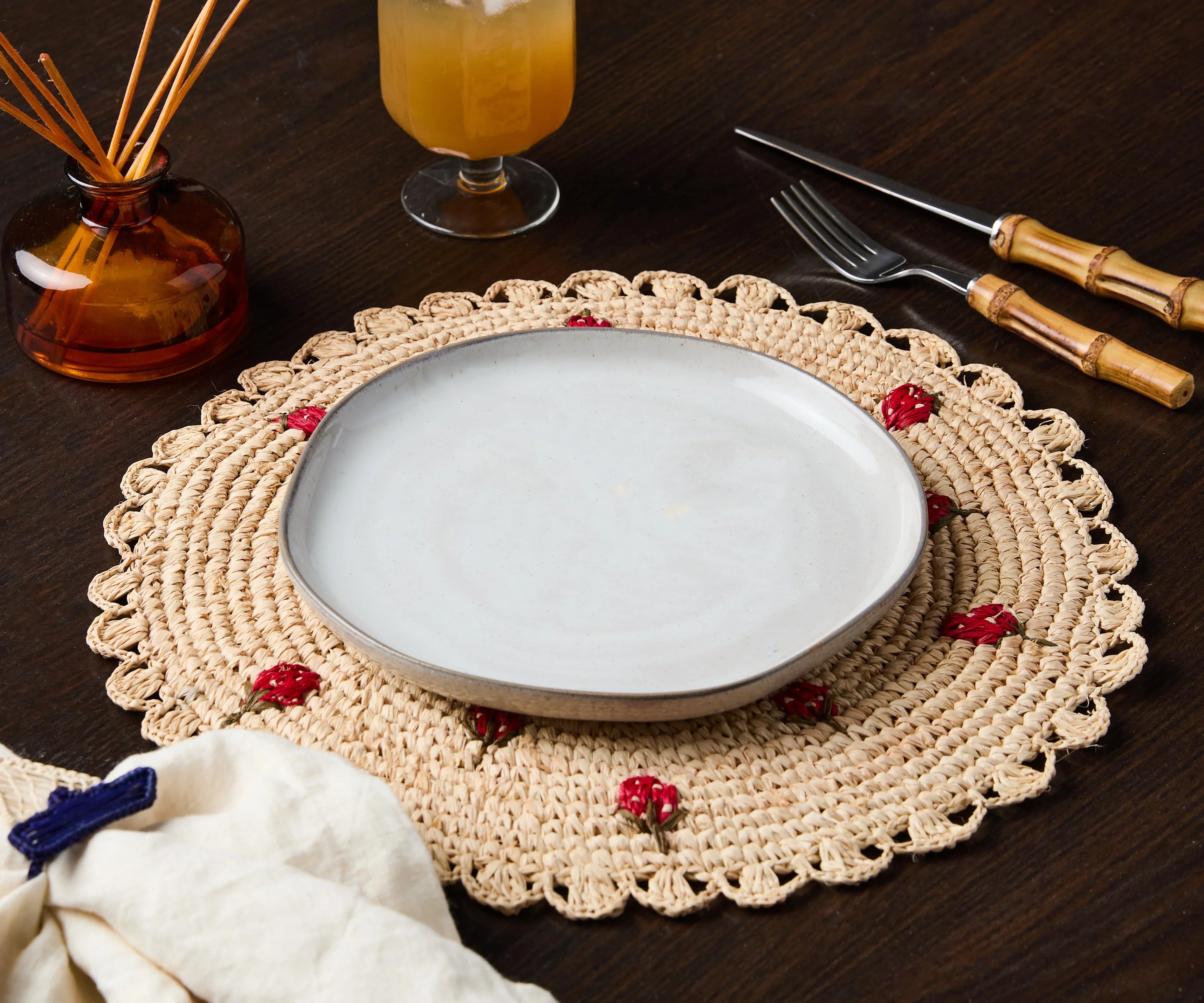 Scattered Strawberry Hand-Crocheted Raffia Palm Round Placemat - The Mayfair Hall