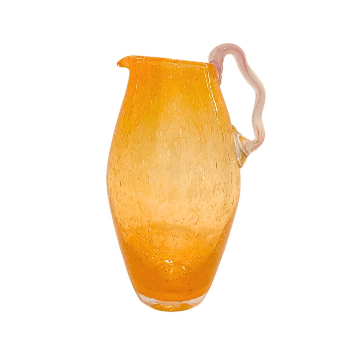 Orange glass pitcher with a handle on a white background